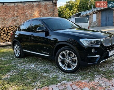 Черный БМВ Х4, объемом двигателя 2 л и пробегом 150 тыс. км за 18000 $, фото 1 на Automoto.ua