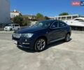 Синий БМВ Х4, объемом двигателя 2 л и пробегом 142 тыс. км за 21500 $, фото 1 на Automoto.ua