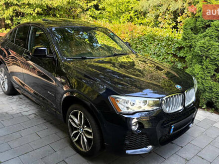 Синий БМВ Х4, объемом двигателя 2 л и пробегом 91 тыс. км за 29500 $, фото 1 на Automoto.ua