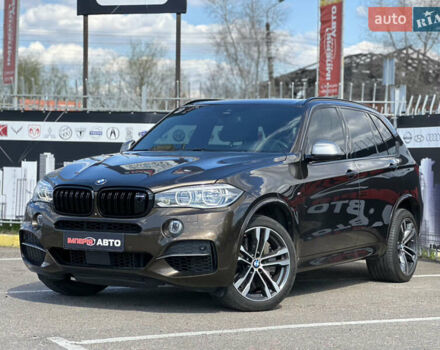Коричневый БМВ Х5 М, объемом двигателя 3 л и пробегом 180 тыс. км за 34900 $, фото 1 на Automoto.ua