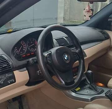 Чорний БМВ Х5, об'ємом двигуна 3 л та пробігом 350 тис. км за 13000 $, фото 4 на Automoto.ua