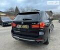 Черный БМВ Х5, объемом двигателя 3 л и пробегом 230 тыс. км за 32500 $, фото 1 на Automoto.ua