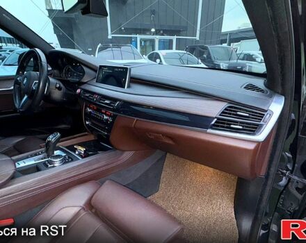 Чорний БМВ Х5, об'ємом двигуна 3 л та пробігом 200 тис. км за 29450 $, фото 3 на Automoto.ua