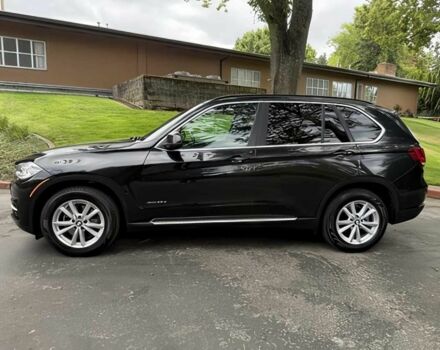 Чорний БМВ Х5, об'ємом двигуна 3 л та пробігом 75 тис. км за 25000 $, фото 3 на Automoto.ua