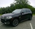 Черный БМВ Х5, объемом двигателя 3 л и пробегом 61 тыс. км за 7477 $, фото 1 на Automoto.ua