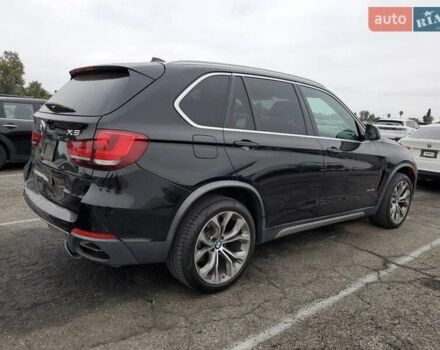 Черный БМВ Х5, объемом двигателя 3 л и пробегом 74 тыс. км за 9500 $, фото 2 на Automoto.ua