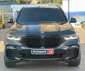 Черный БМВ Х5, объемом двигателя 3 л и пробегом 94 тыс. км за 64940 $, фото 1 на Automoto.ua
