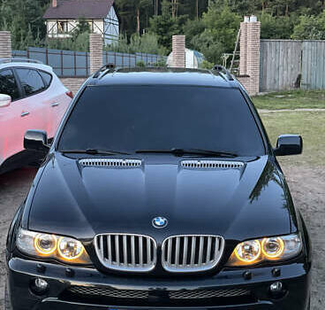 Чорний БМВ Х5, об'ємом двигуна 4.4 л та пробігом 165 тис. км за 12000 $, фото 1 на Automoto.ua