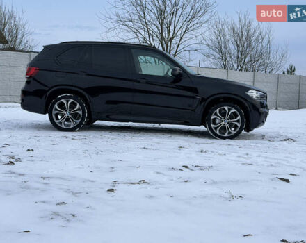 Черный БМВ Х5, объемом двигателя 3 л и пробегом 240 тыс. км за 25900 $, фото 1 на Automoto.ua
