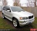 Серый БМВ Х5, объемом двигателя 3 л и пробегом 300 тыс. км за 8000 $, фото 1 на Automoto.ua
