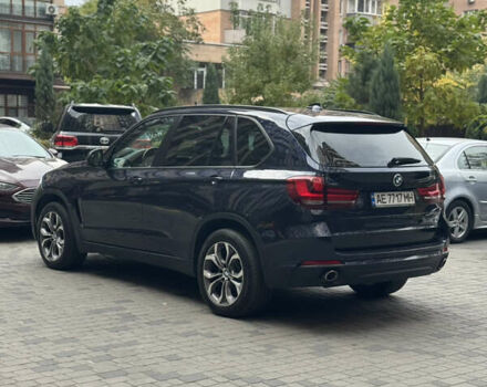 Синій БМВ Х5, об'ємом двигуна 2 л та пробігом 100 тис. км за 29999 $, фото 1 на Automoto.ua