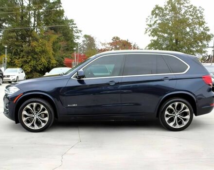 Синий БМВ Х5, объемом двигателя 3 л и пробегом 58 тыс. км за 17300 $, фото 3 на Automoto.ua