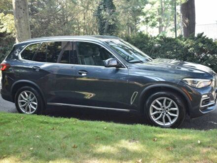 Синий БМВ Х5, объемом двигателя 3 л и пробегом 32 тыс. км за 24300 $, фото 1 на Automoto.ua