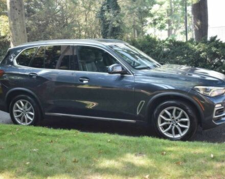 Синий БМВ Х5, объемом двигателя 3 л и пробегом 32 тыс. км за 24300 $, фото 1 на Automoto.ua