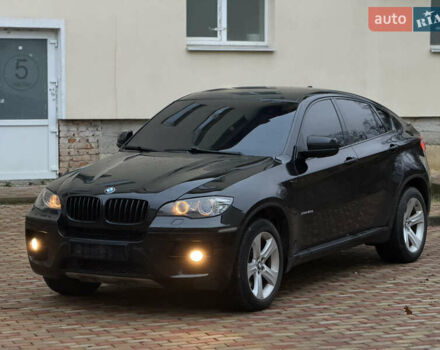 Черный БМВ Х6, объемом двигателя 3 л и пробегом 300 тыс. км за 18900 $, фото 1 на Automoto.ua