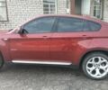 Червоний БМВ Х6, об'ємом двигуна 4 л та пробігом 198 тис. км за 8500 $, фото 1 на Automoto.ua