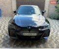 Черный БМВ i4, объемом двигателя 0 л и пробегом 4 тыс. км за 40500 $, фото 1 на Automoto.ua