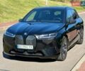 Черный БМВ iX, объемом двигателя 0 л и пробегом 20 тыс. км за 48400 $, фото 1 на Automoto.ua
