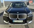 Черный БМВ iX1, объемом двигателя 0 л и пробегом 1 тыс. км за 51851 $, фото 1 на Automoto.ua