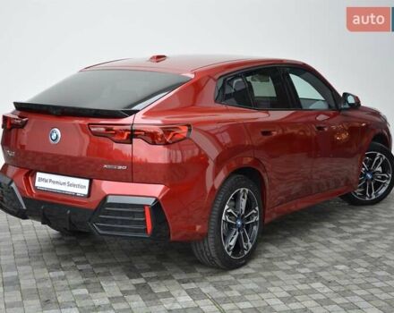 Красный БМВ iX2, объемом двигателя 0 л и пробегом 9 тыс. км за 53143 $, фото 2 на Automoto.ua