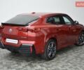 Красный БМВ iX2, объемом двигателя 0 л и пробегом 9 тыс. км за 53143 $, фото 2 на Automoto.ua