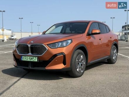 БМВ iX2 2024 в Житомире на Automoto.ua Оранжевый БМВ iX2, объемом двигателя 0 л и пробегом 10 тыс. км за 49803 $, фото 1 на Automoto.ua