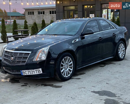 Черный Кадиллак СТС, объемом двигателя 3 л и пробегом 250 тыс. км за 7800 $, фото 1 на Automoto.ua