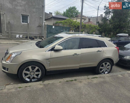Бежевий Каділак SRX, об'ємом двигуна 3 л та пробігом 248 тис. км за 11499 $, фото 1 на Automoto.ua