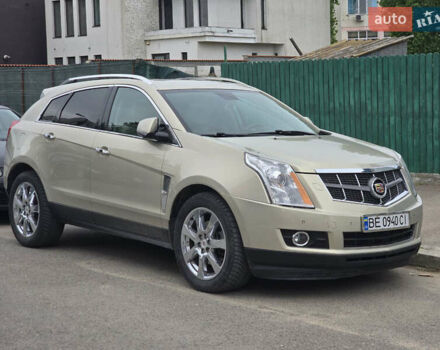 Бежевий Каділак SRX, об'ємом двигуна 3 л та пробігом 248 тис. км за 11500 $, фото 1 на Automoto.ua