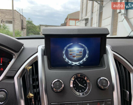 Чорний Каділак SRX, об'ємом двигуна 3 л та пробігом 144 тис. км за 11000 $, фото 3 на Automoto.ua