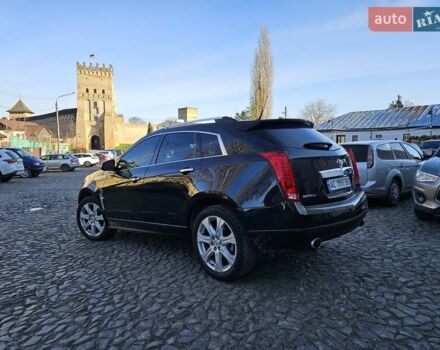 Чорний Каділак SRX, об'ємом двигуна 2.99 л та пробігом 209 тис. км за 11900 $, фото 2 на Automoto.ua