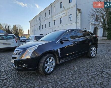 Чорний Каділак SRX, об'ємом двигуна 2.99 л та пробігом 209 тис. км за 11900 $, фото 1 на Automoto.ua