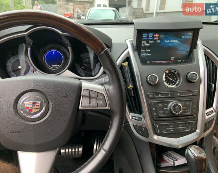 Чорний Каділак SRX, об'ємом двигуна 3 л та пробігом 144 тис. км за 11000 $, фото 7 на Automoto.ua