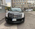 Чорний Каділак SRX, об'ємом двигуна 3 л та пробігом 130 тис. км за 14500 $, фото 1 на Automoto.ua