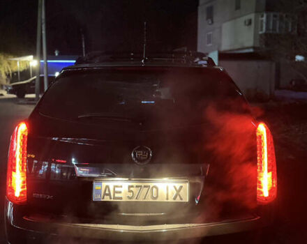 Чорний Каділак SRX, об'ємом двигуна 3 л та пробігом 144 тис. км за 11000 $, фото 1 на Automoto.ua