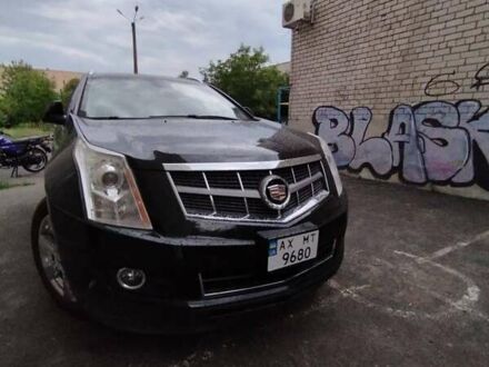 Каділак SRX 2009 у Змиеве на Automoto.ua Чорний Каділак SRX, об'ємом двигуна 3 л та пробігом 177 тис. км за 7999 $, фото 1 на Automoto.ua