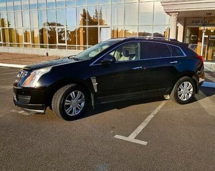 Чорний Каділак SRX, об'ємом двигуна 3 л та пробігом 169 тис. км за 12000 $, фото 1 на Automoto.ua