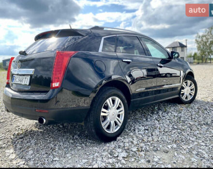 Чорний Каділак SRX, об'ємом двигуна 3 л та пробігом 230 тис. км за 12000 $, фото 1 на Automoto.ua
