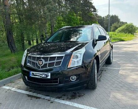 Чорний Каділак SRX, об'ємом двигуна 3 л та пробігом 202 тис. км за 15300 $, фото 1 на Automoto.ua