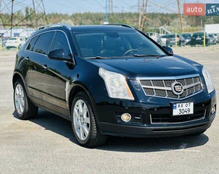 Чорний Каділак SRX, об'ємом двигуна 3 л та пробігом 146 тис. км за 13200 $, фото 1 на Automoto.ua