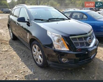 Чорний Каділак SRX, об'ємом двигуна 3 л та пробігом 316 тис. км за 14200 $, фото 1 на Automoto.ua