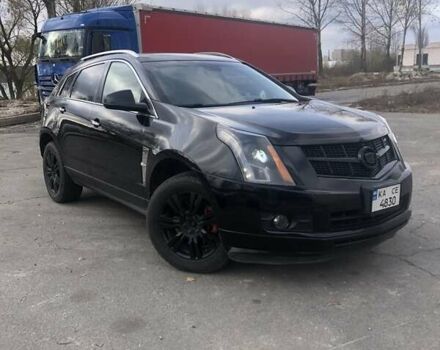 Чорний Каділак SRX, об'ємом двигуна 3 л та пробігом 390 тис. км за 8900 $, фото 1 на Automoto.ua