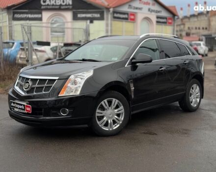 Чорний Каділак SRX, об'ємом двигуна 3 л та пробігом 195 тис. км за 10790 $, фото 1 на Automoto.ua