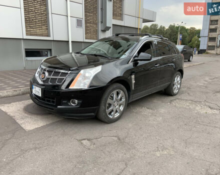 Чорний Каділак SRX, об'ємом двигуна 3 л та пробігом 146 тис. км за 10700 $, фото 1 на Automoto.ua