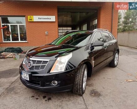 Чорний Каділак SRX, об'ємом двигуна 3 л та пробігом 140 тис. км за 10000 $, фото 1 на Automoto.ua
