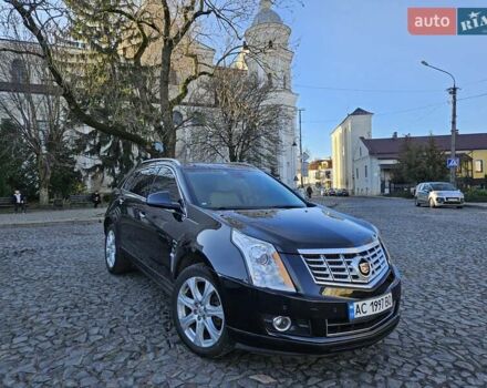 Чорний Каділак SRX, об'ємом двигуна 2.99 л та пробігом 209 тис. км за 11900 $, фото 1 на Automoto.ua