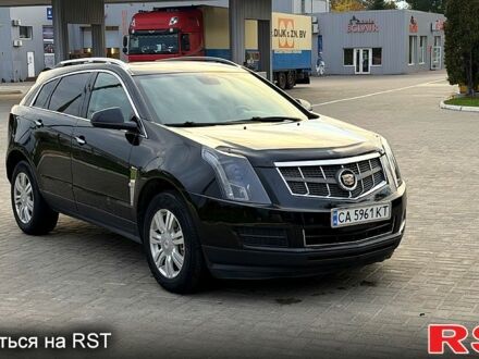 Чорний Каділак SRX, об'ємом двигуна 3 л та пробігом 167 тис. км за 11000 $, фото 1 на Automoto.ua