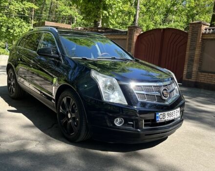 Чорний Каділак SRX, об'ємом двигуна 3 л та пробігом 118 тис. км за 14400 $, фото 1 на Automoto.ua