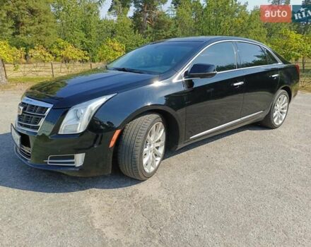 Черный Кадиллак ХТС, объемом двигателя 3.6 л и пробегом 140 тыс. км за 15800 $, фото 1 на Automoto.ua