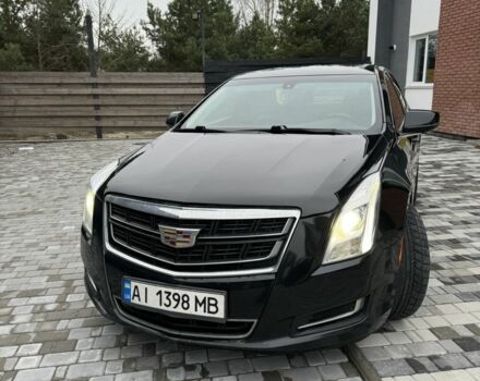 Черный Кадиллак ХТС, объемом двигателя 3.6 л и пробегом 330 тыс. км за 13000 $, фото 1 на Automoto.ua